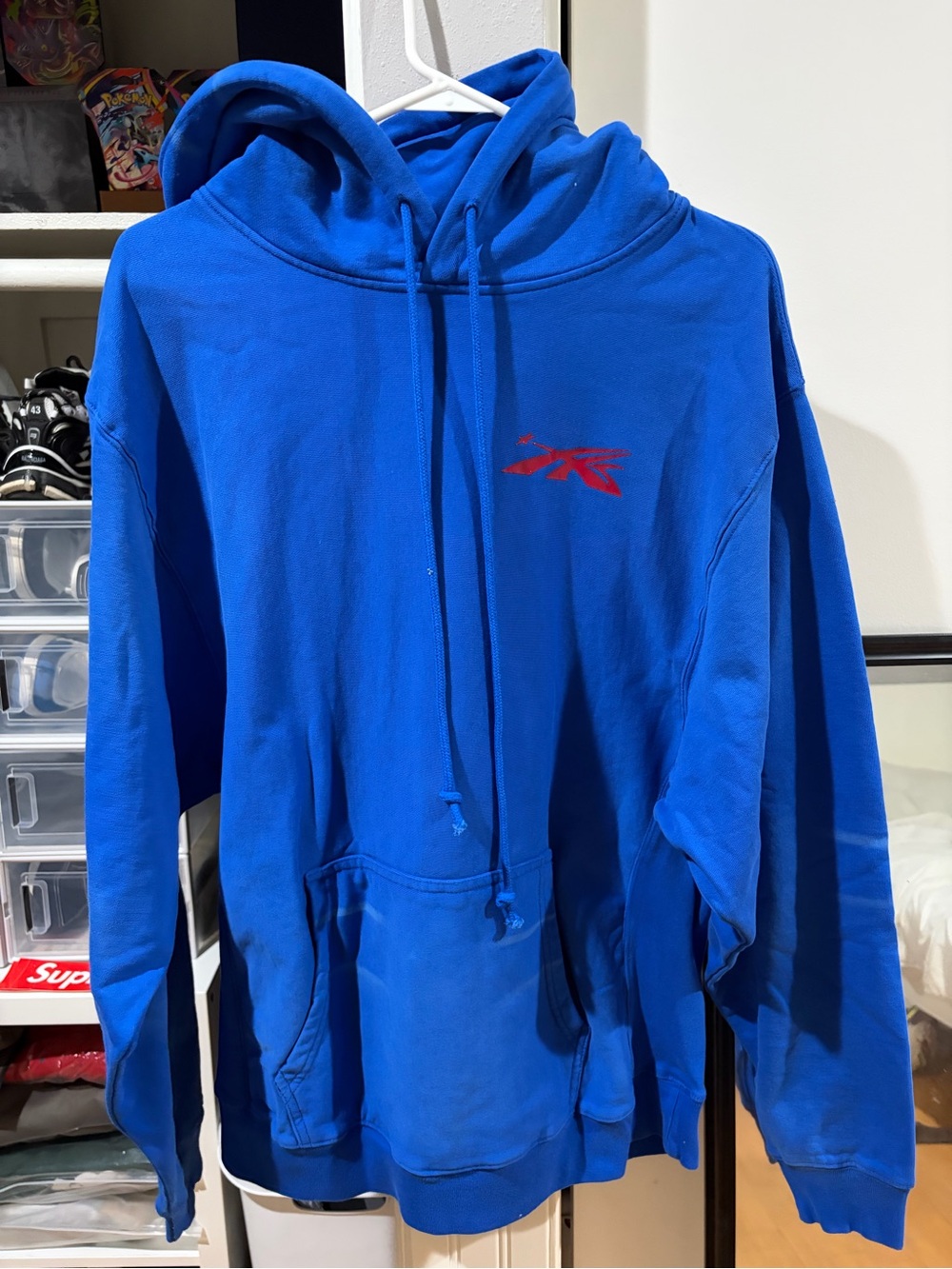 Men's Blue Pullover Hoodie with Subtle Logo fits like a large